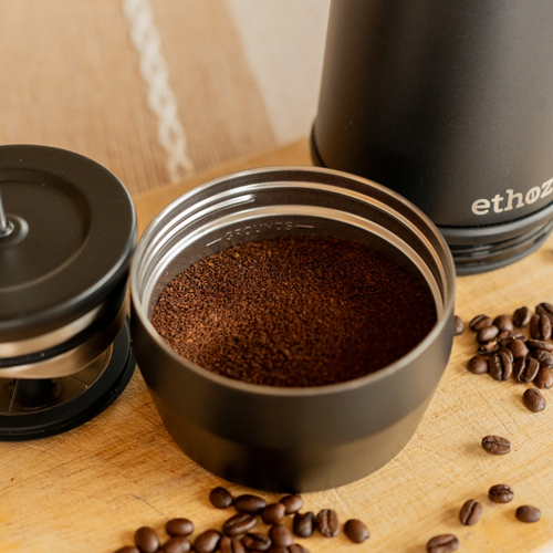 Coffee beans being pressed to make espresso (image source:https://planetarydesign.com/blogs/news/how-to-make-espresso-with-a-french-press?srsltid=AfmBOoqVVmXtEvIL5OOQ34ITrWb898D2ndb1cAnfLWaodDEJDxUoQfaS)<br><audio controls src='/audio/Coffee press.m4a'></audio>