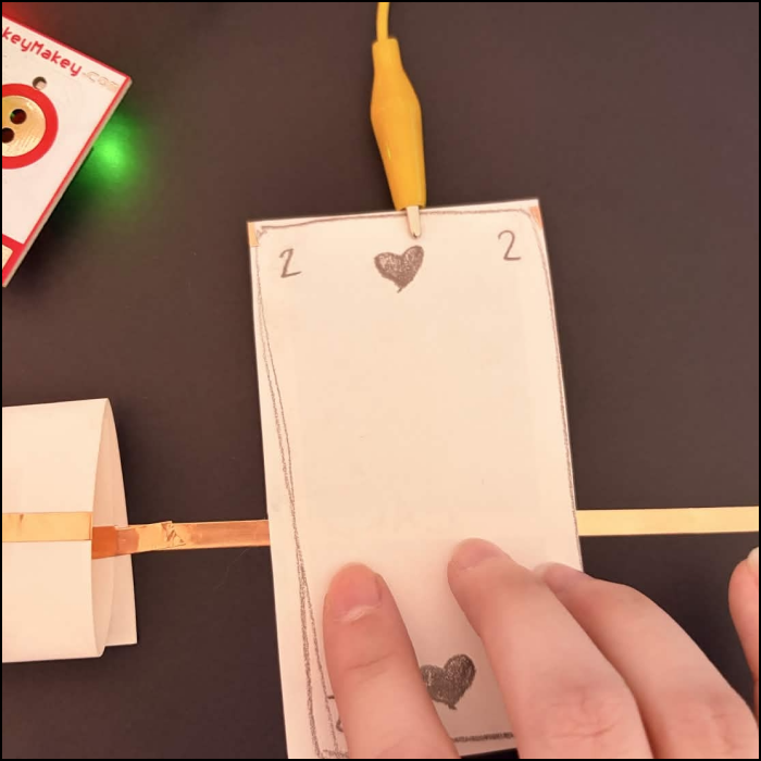 Here's the system working as the tape makes contact after flipping the card over.